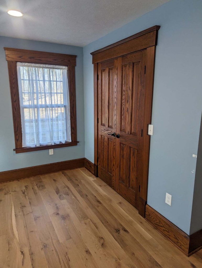 Bedroom with freshly painted blue walls by Painting by DeAnna, expert interior painting in Canton, Ohio.